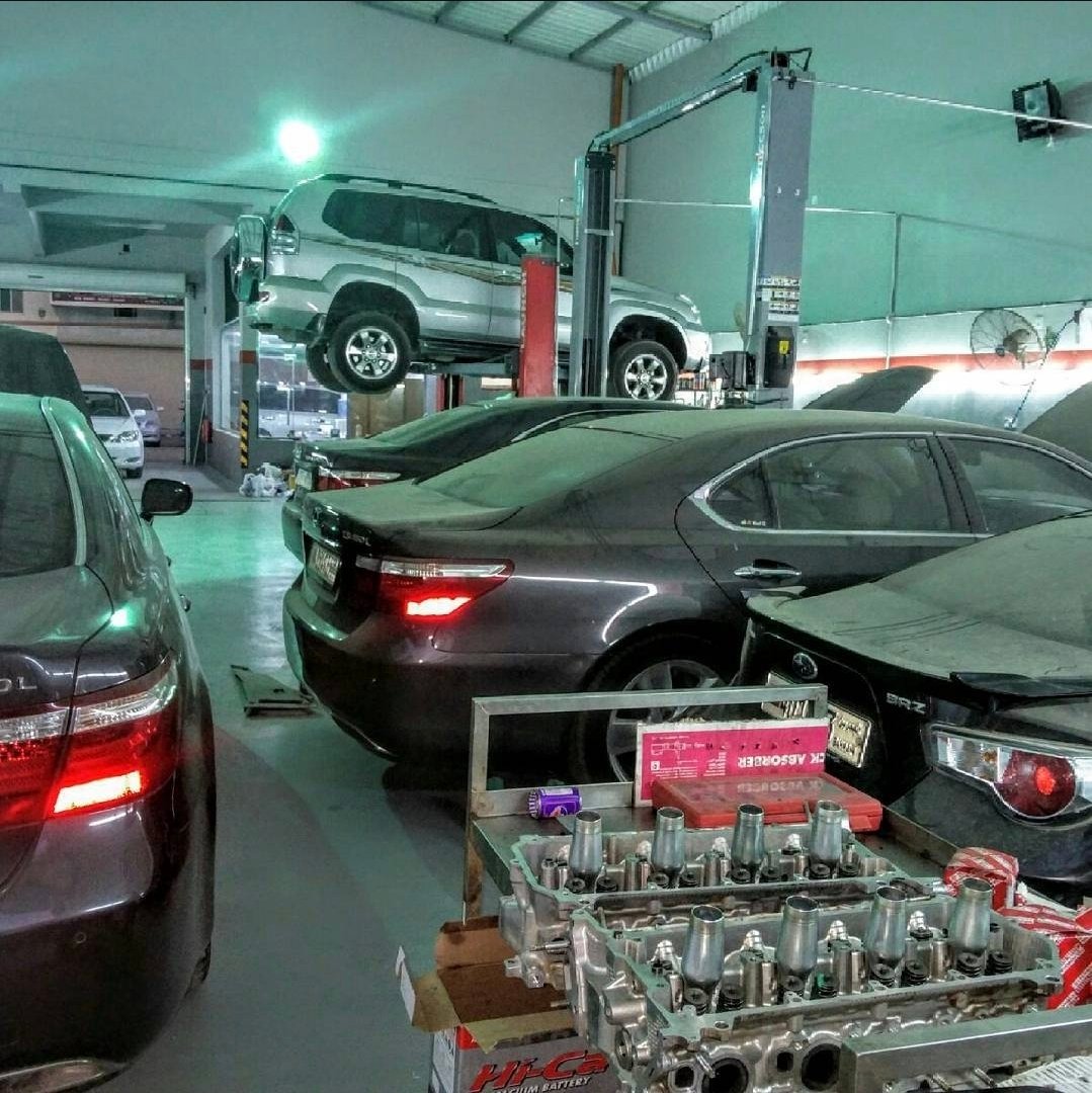 Multiple vehicles on lifts in the workshop