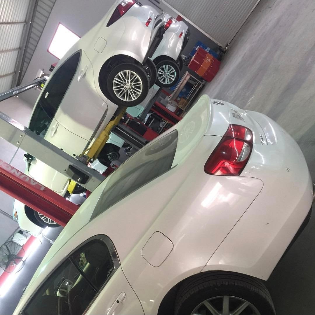 Sports cars being serviced in the workshop