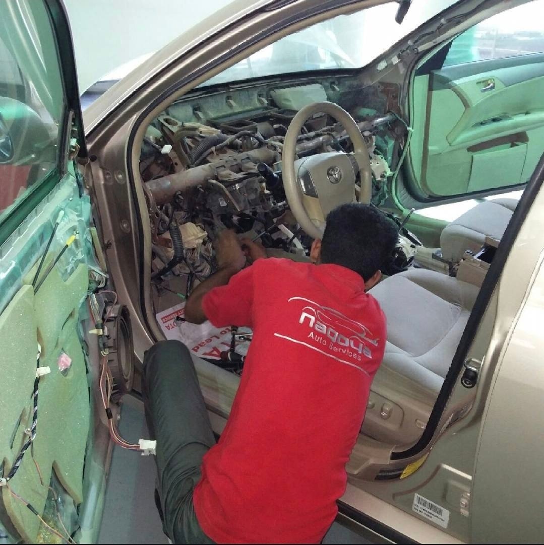 Technician working on Toyota electrical wiring